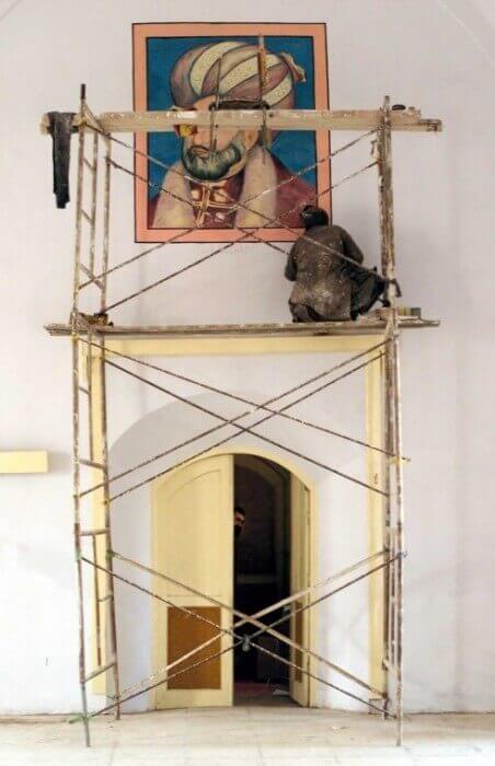 Artist Moheb works in his studio in Kabul, Afghanistan.